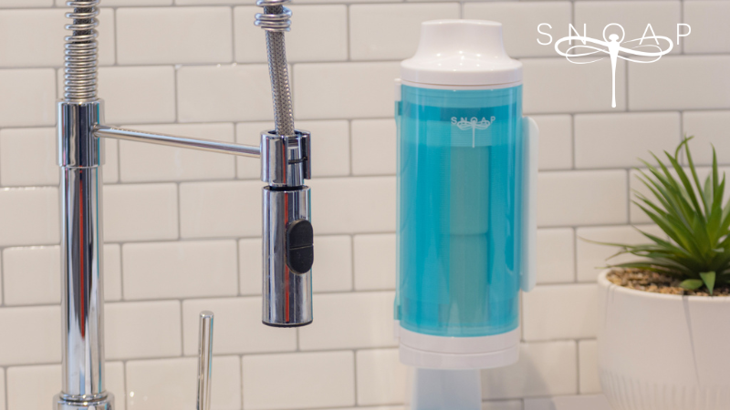 SNOAP refillable soap dispenser system for kitchen use, providing an eco-friendly alternative to liquid hand soap bottles.