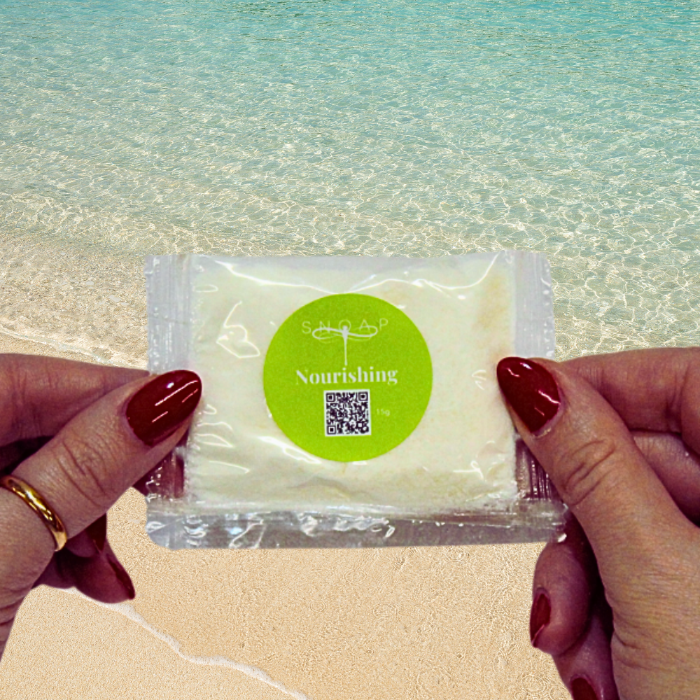 Nourishing Shea & Buttermilk SNOAP soap sample on beach background
