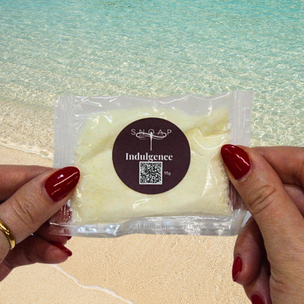 Indulgence White Tea with Vitamin E SNOAP soap sample on beach background