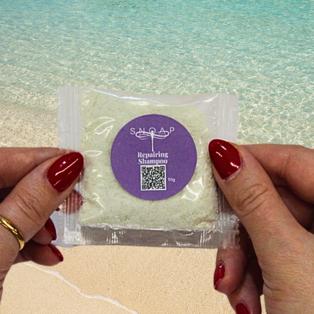 Repairing Shampoo Lavender mint & Spirulina SNOAP shampoo sample for coloured or damaged hair on beach background