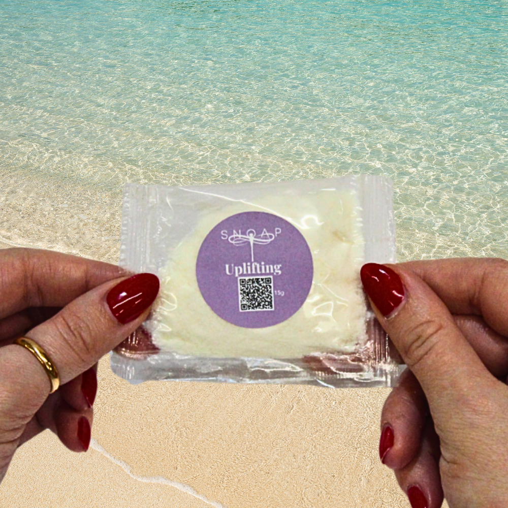 Uplifting Lavender & Geranium SNOAP soap sample on beach background