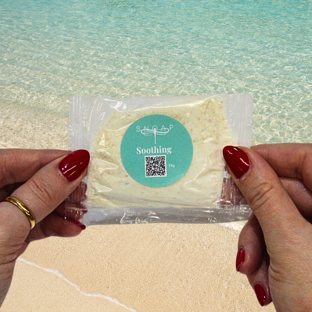 Soothing Tea Tree & Oat SNOAP soap sample on beach background