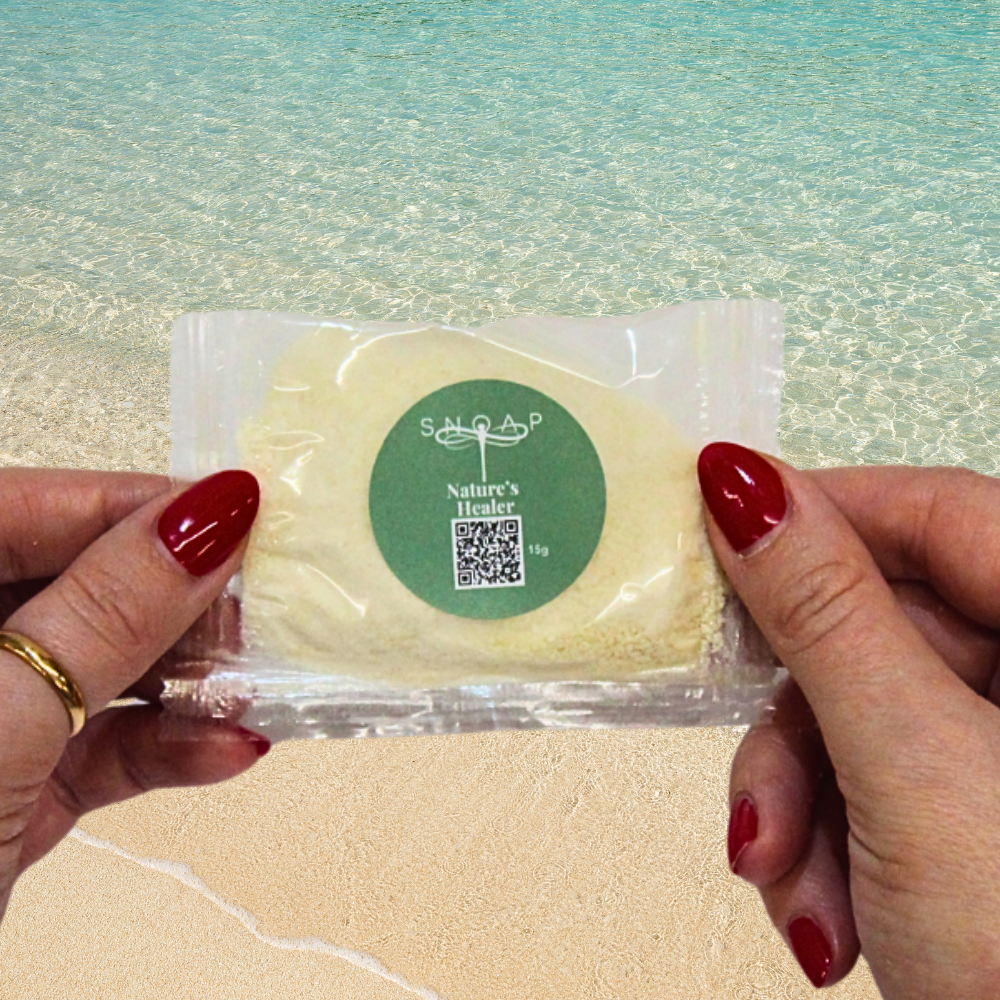 Nature's Healer Tea Tree Organic Olive Oil SNOAP soap sample on beach background