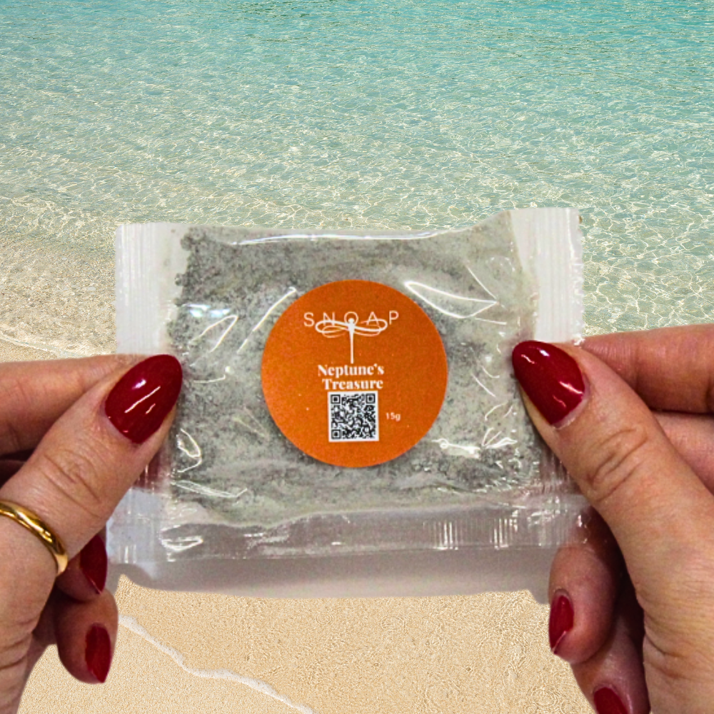 Neptune's Treasure Dead Sea Mud Organic Olive Oil SNOAP soap sample on beach background