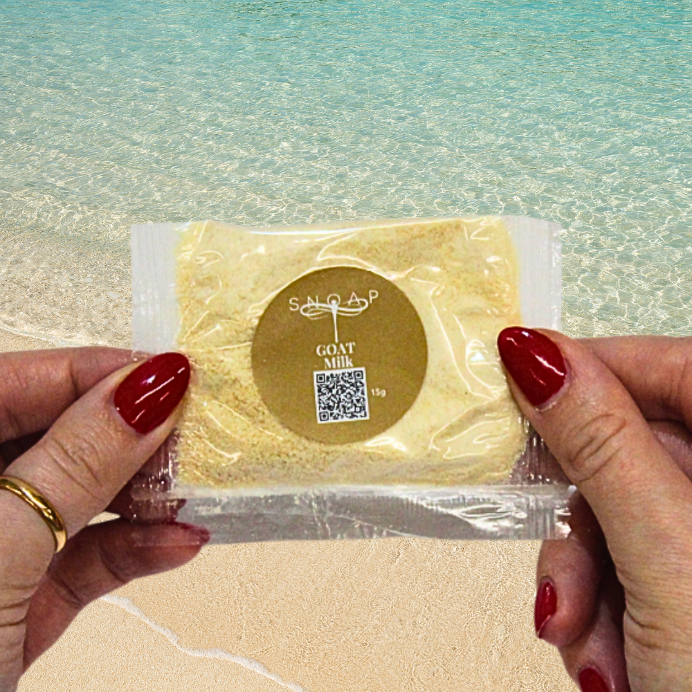 Greatest of All Time Goat Milk with hint of rose and vanilla Organic Olive Oil SNOAP soap sample on beach background