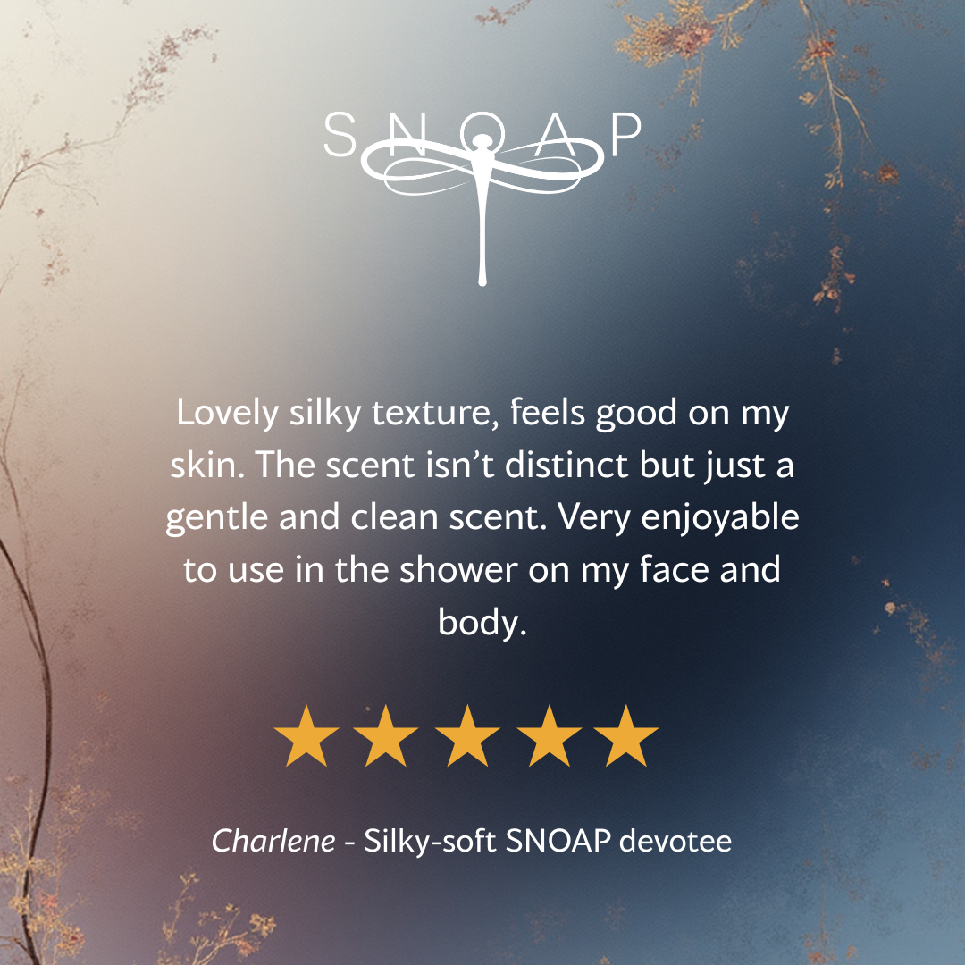 Five-star customer review for SNOAP GOAT milk soap saying it has a lovely silky feel and subtle fragrance, with SNOAP logo on soft blue gradient background