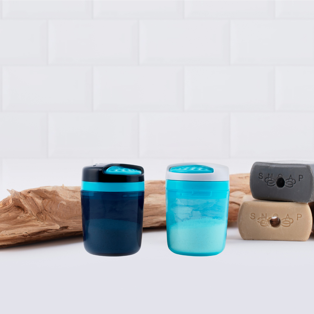 Two refillable SNOAP On The Go dispensers