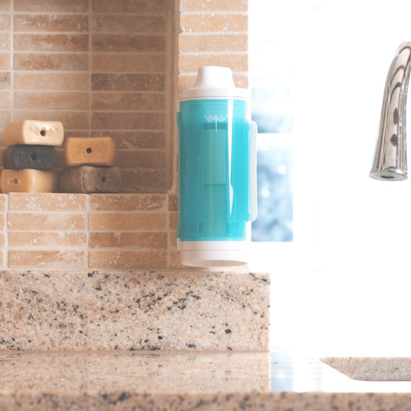 SNOAP Dispenser in White & SNOAP blue Wall mounted in kitchen