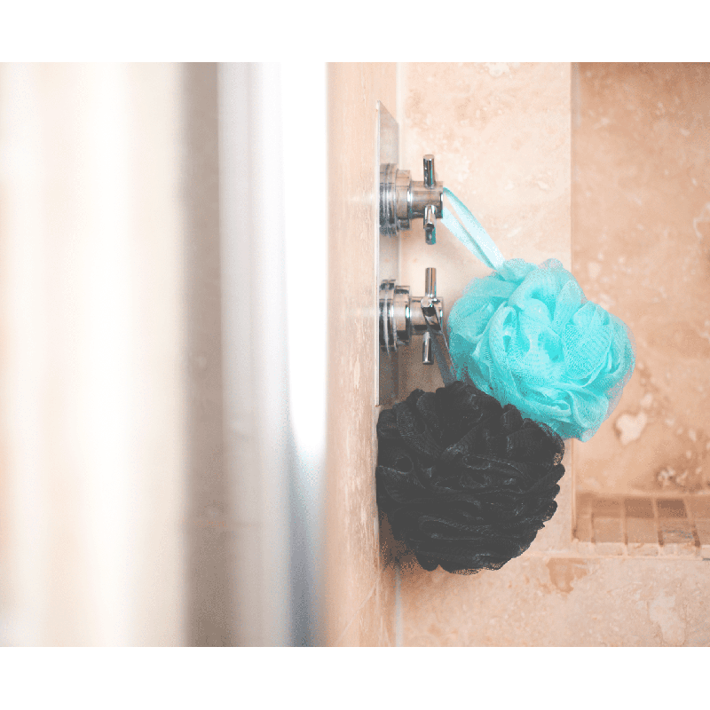 Two eco shower puffs made from recycled ocean plastic bottles