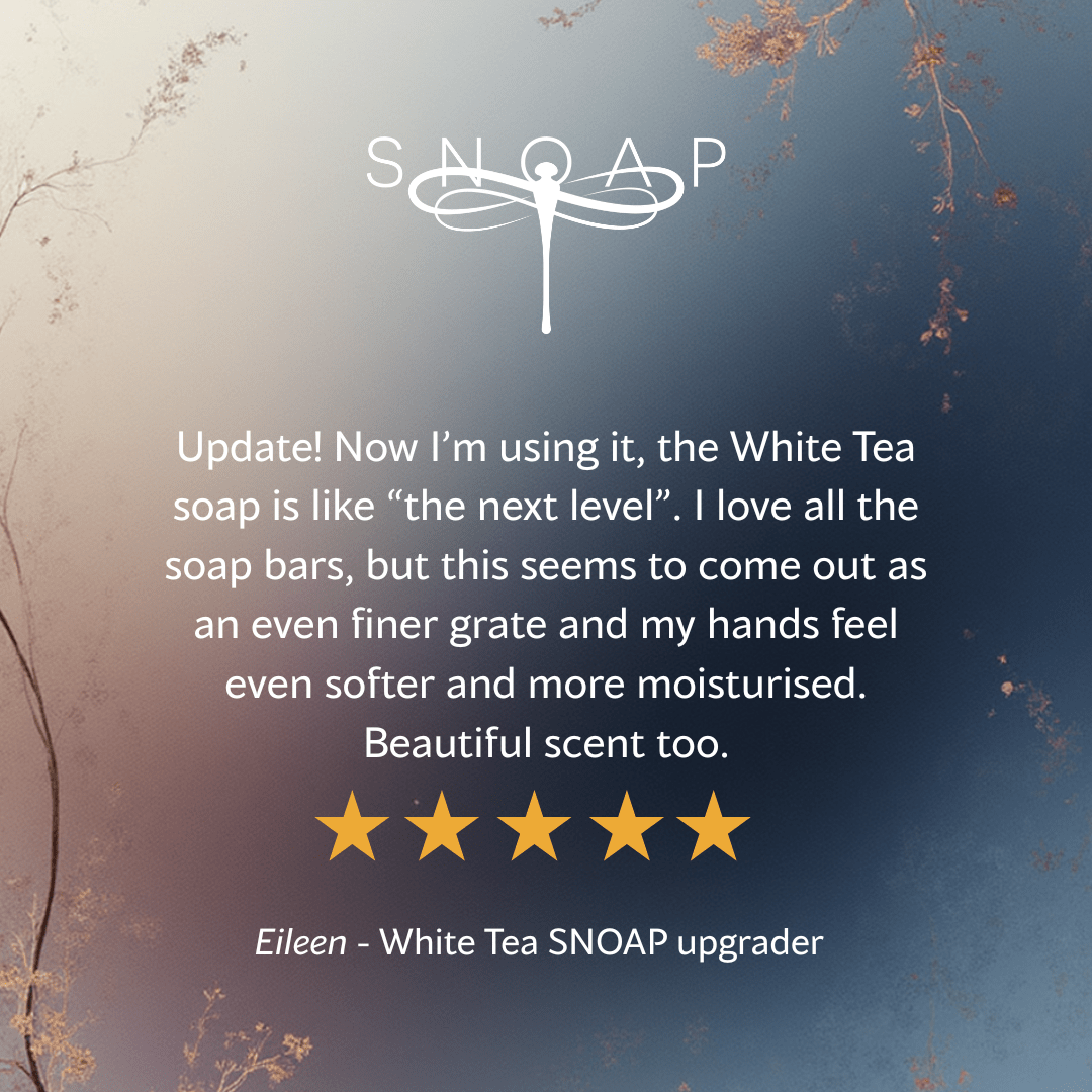 Five-star customer review for SNOAP Indulgence white tea with Vitamin E saying it leaves hands soft and moisturised with a beautiful scent, with SNOAP logo on soft blue gradient background