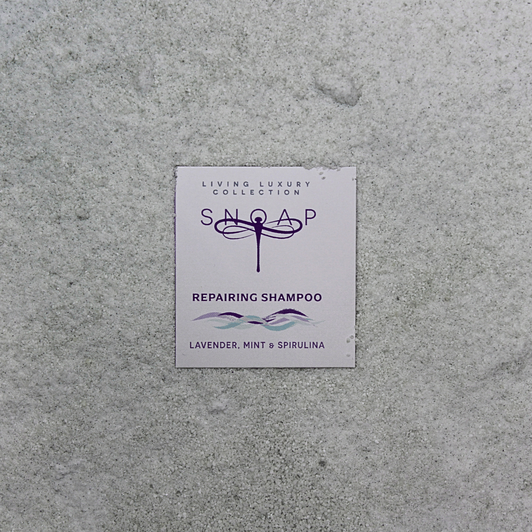 Repairing SNOAP pre-ground shampoo. Infused with plant-based proteins and natural oils to restore and strengthen dry or coloured hair
