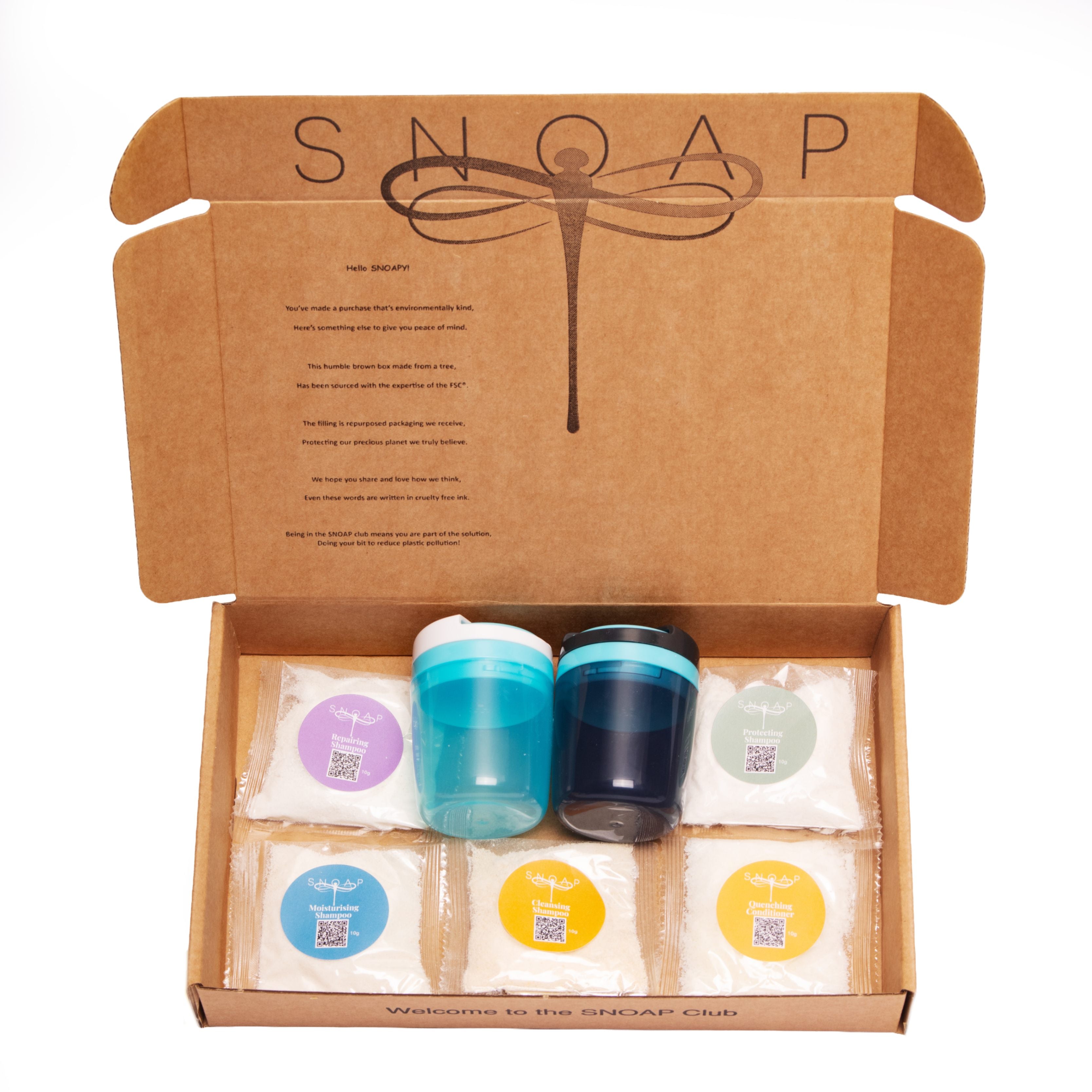 SNOAP hair care sampler products displayed in SNOAP branded box including 4 shampoos, one conditioner and 2 on-the-go dispensers to dispense them from