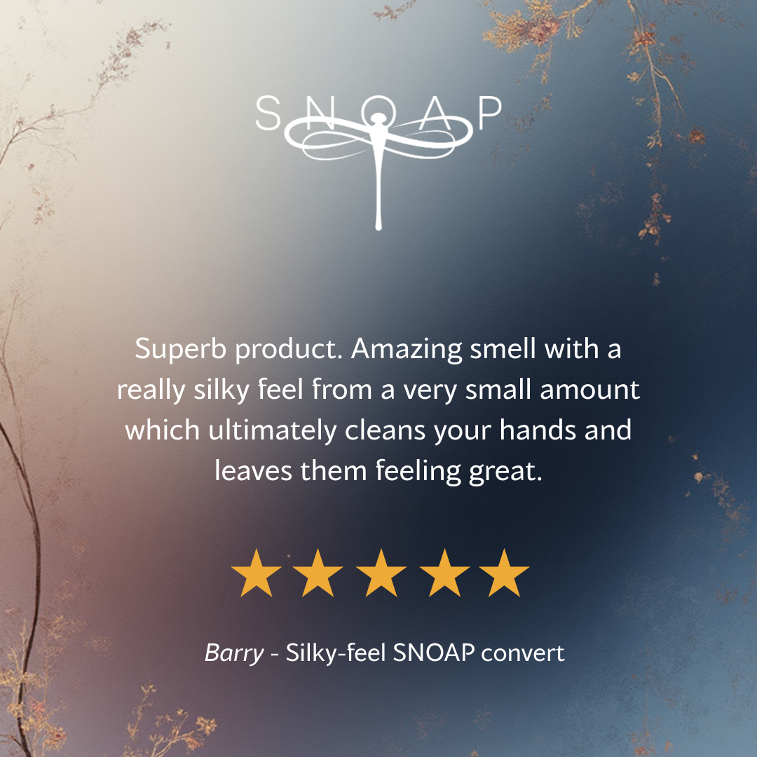 Five-star customer review for SNOAP Uplifting Soap saying it has an amazing smell and silky feel with a small amount going a long way, with SNOAP logo on soft blue gradient background