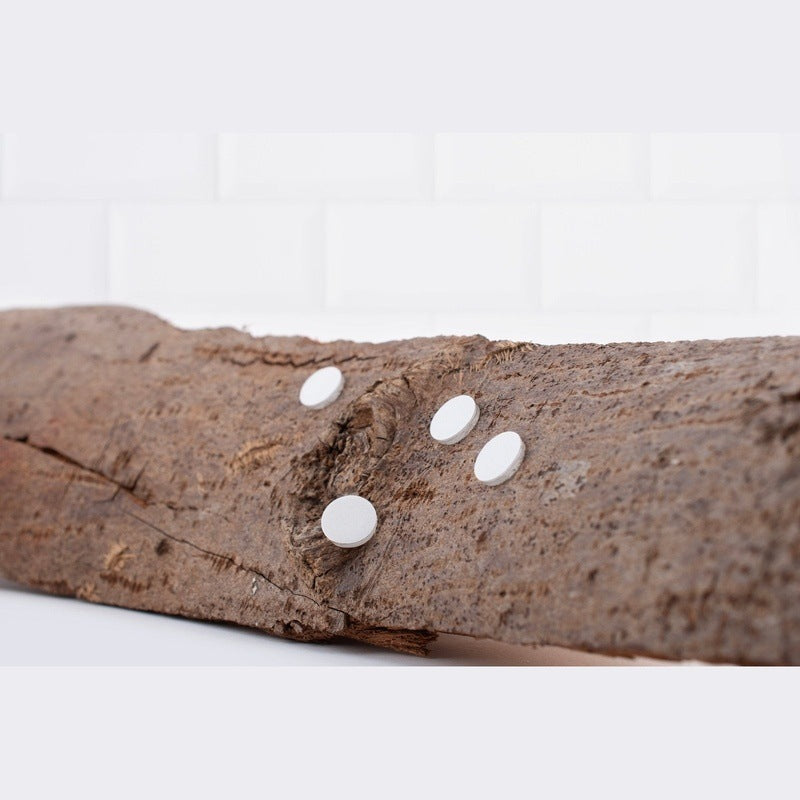 SNOAP replacement sticky feet shown on log
