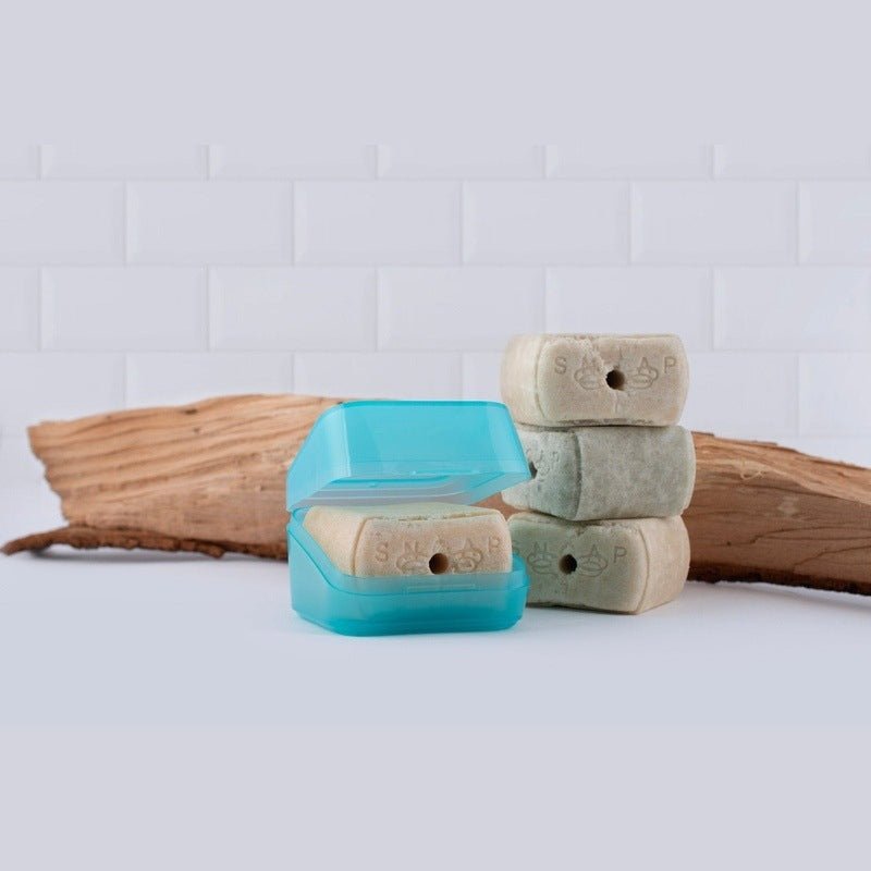 SNOAP soap box in Theia SNOAP blue displayed with shampoo bars