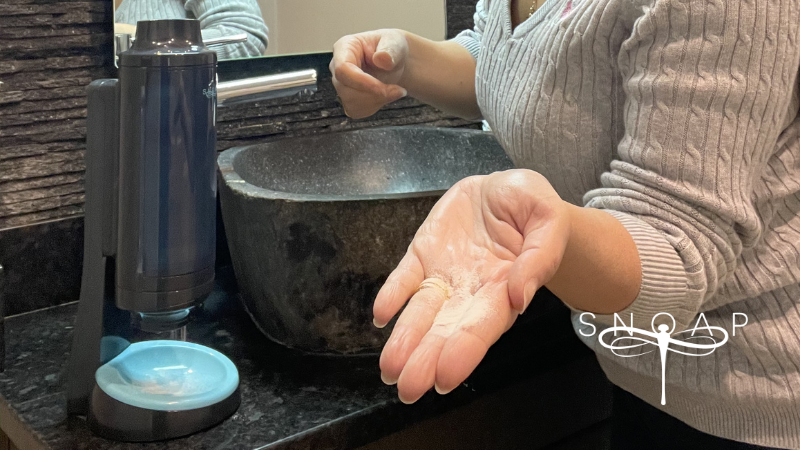 snoap-refillable-soap-dispenser-powder-in-hand.jpg
