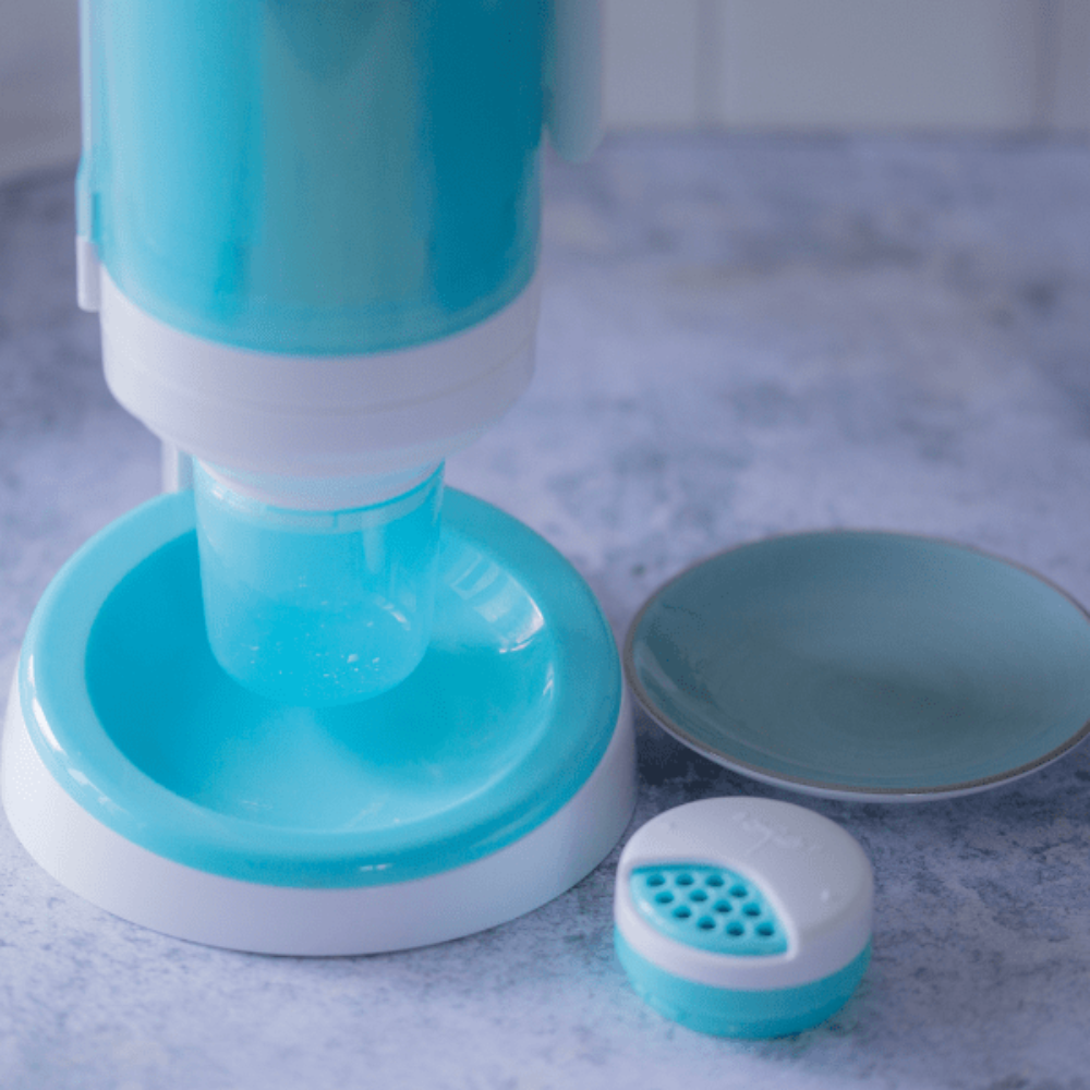 Image showing Theia white funnel on dispenser connected to on the go dispenser base for filling.